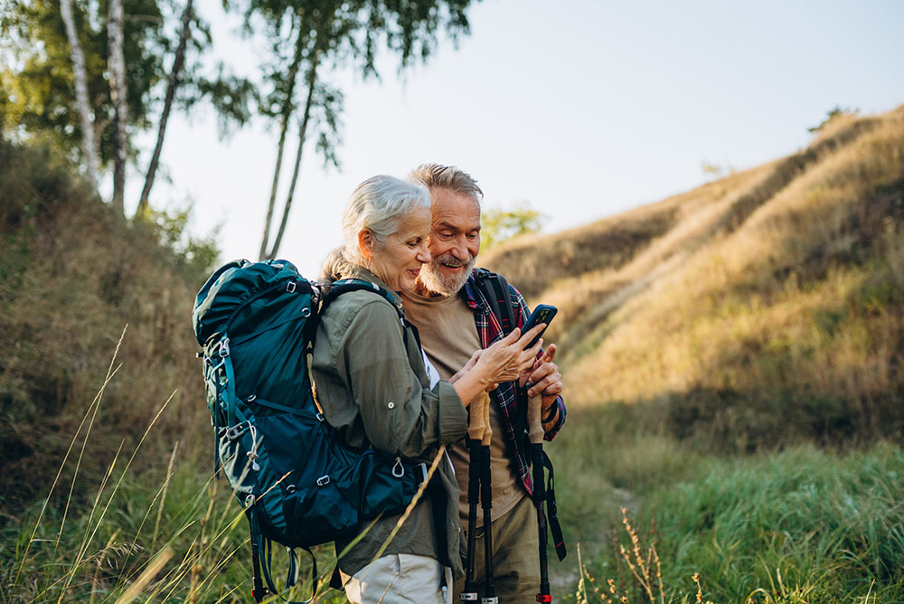 Older couple hiking outdoors
